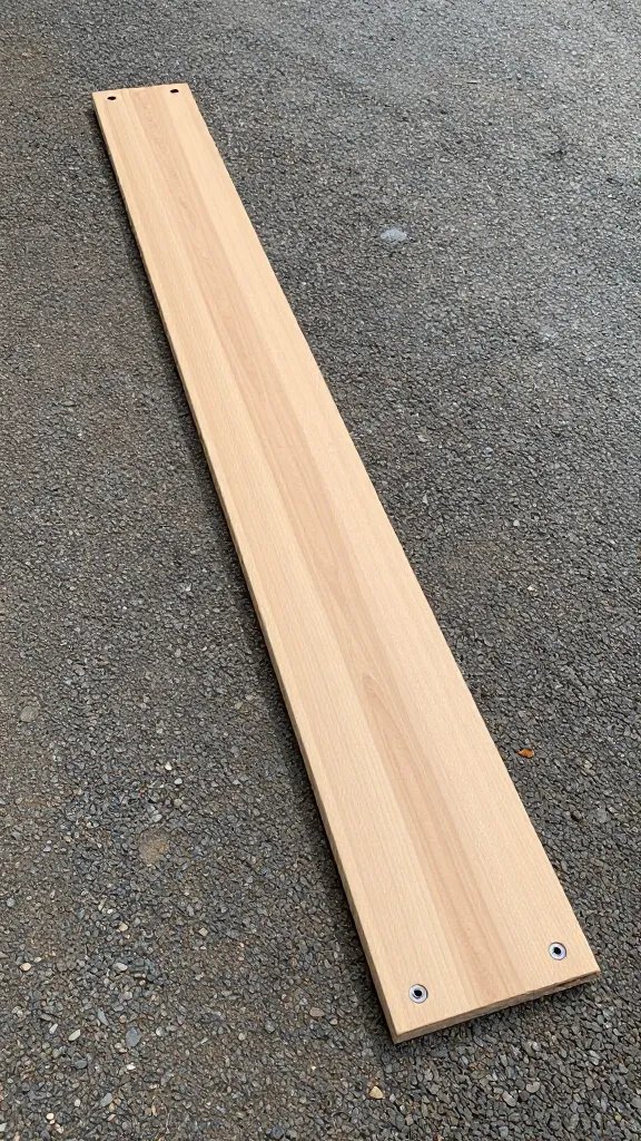 closeup of edging board installed along gravel patio edge